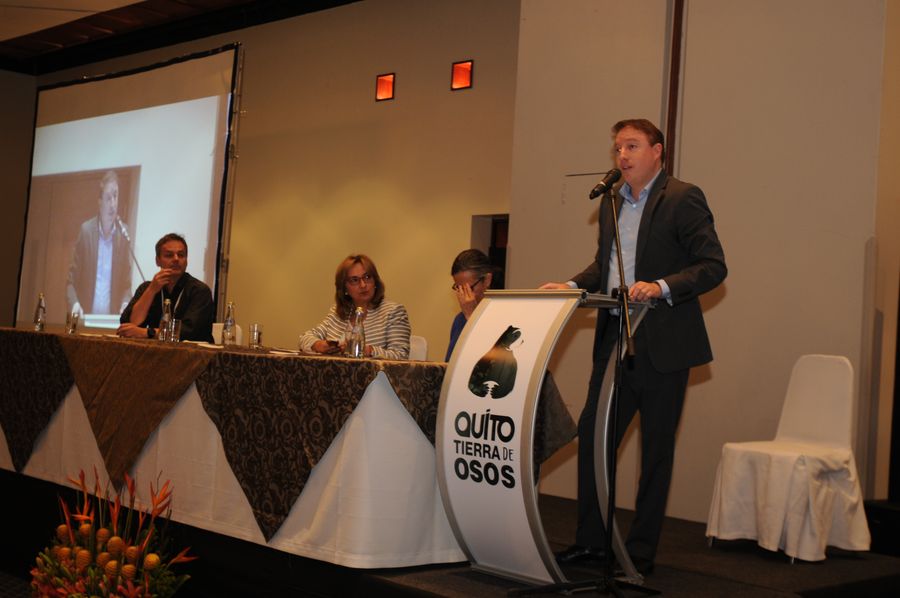 Panel discussion at an international bear conference in Quito, speaker at podium