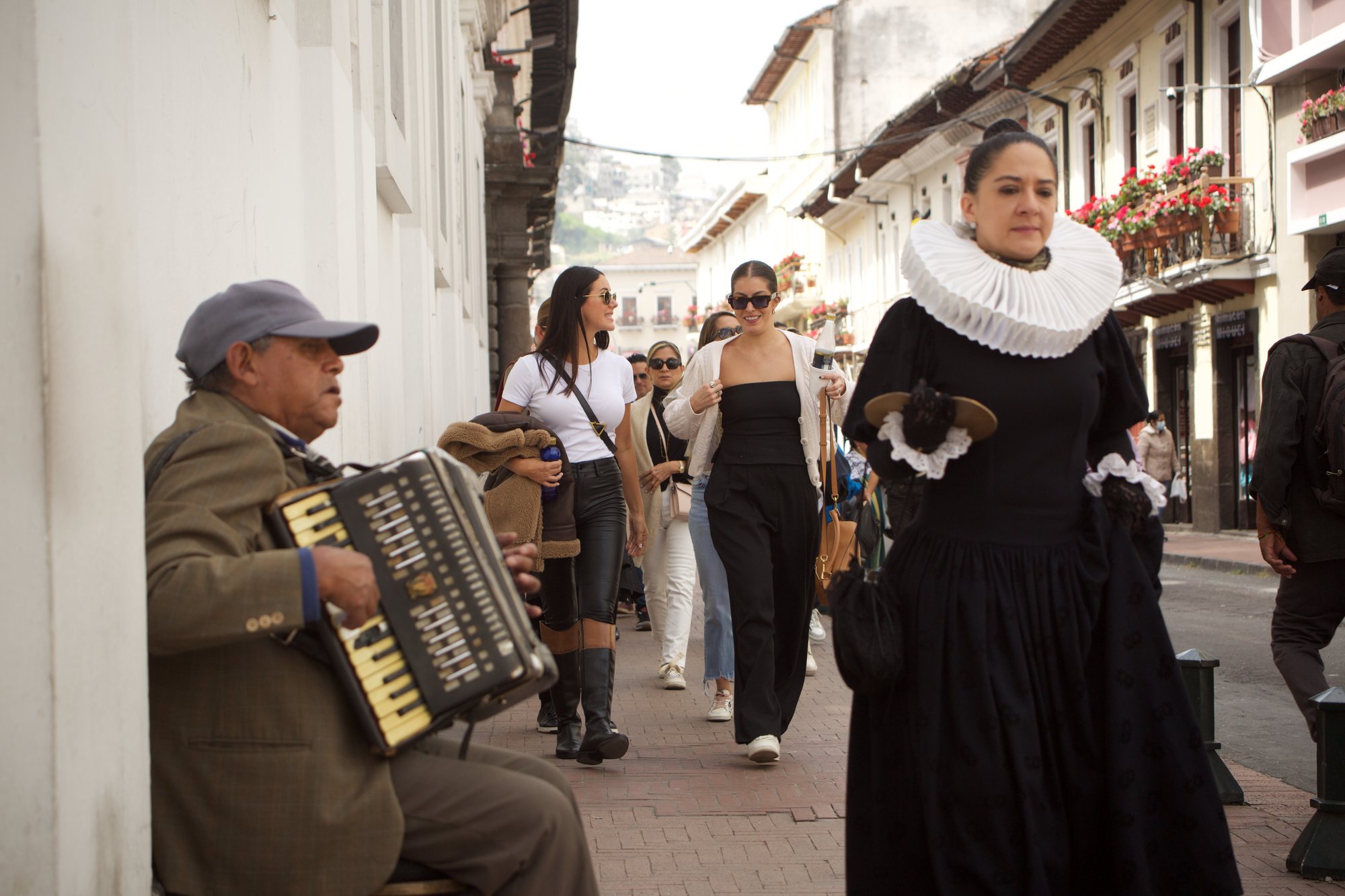 A corporate group guided through Quito's historic center by a costumed colonial character